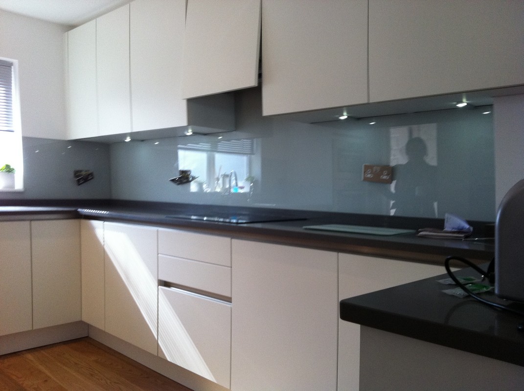 Grey glass kitchen splashback with LED lighting in Sutton